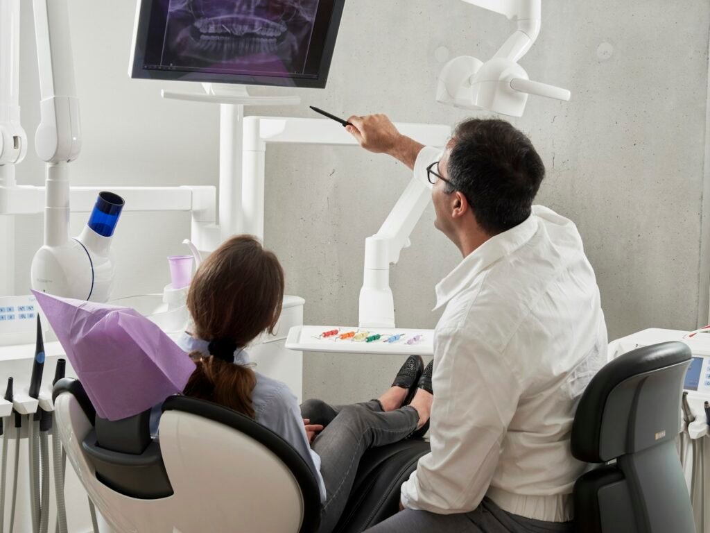 Dentist and assistant treating a patient at the Bright Smile clinic in Dubai