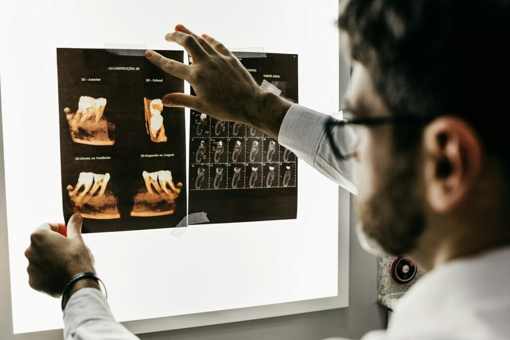 Dentist reviewing digital dental X-rays at Bright Smile Dental Clinic, JLT Dubai